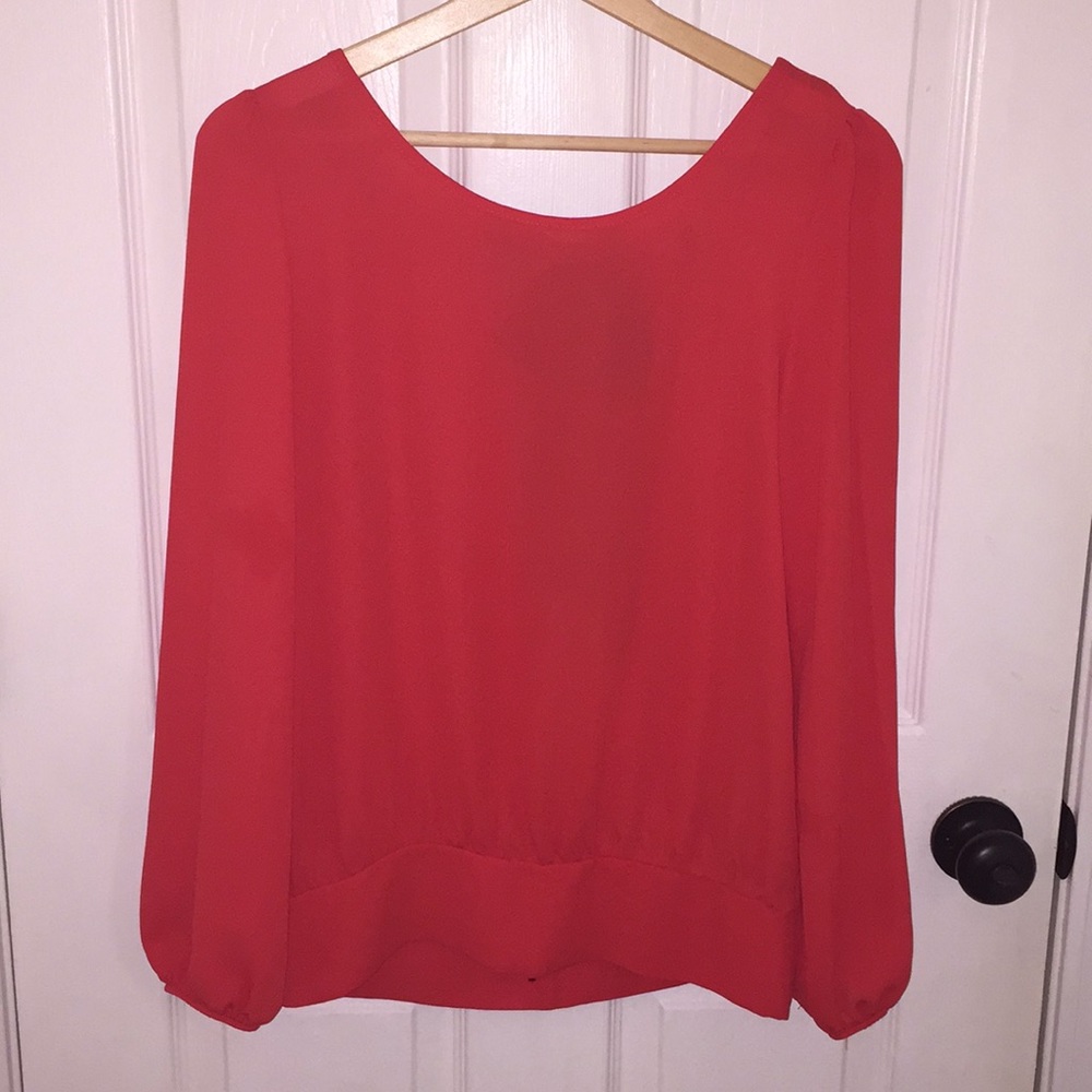 Red Blouse with Black Bow & Slit Detailing…